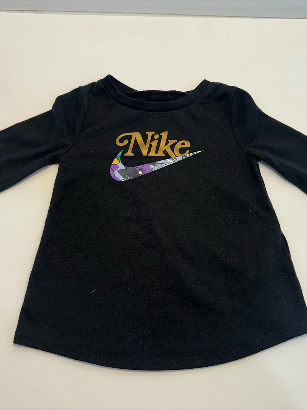 Nike Kid's Black Long Sleeve Tee with Gold Logo and Floral Swoosh